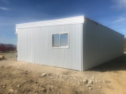 New shed with freshly installed profiled steel cladding