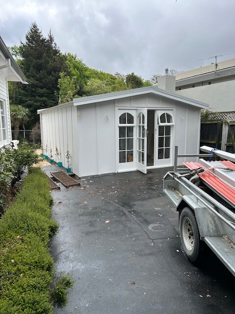 The garden room from the driveway, cladding complete and roofing still to go on