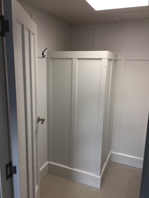 Built-in wardrobe with hanging rails and shelving