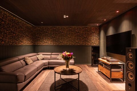 Lounge and media area with corner seating inside the converted garage
